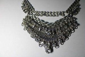 lot 161 image: Signed Express prong set Rhinestone bib style necklace. Marked with Express hang tag. 14L, Overall length 20L