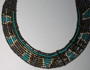 lot 162 image: Signed Express micro beaded bib style necklace. Marked with Express hang tag. 16L with 3 extender
