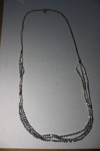 lot 163 image: Signed Express faceted metal and glass bead necklace. Marked with Express hang tag. 34L