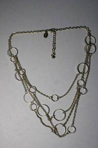 lot 167 image: Signed Express circle station necklace. 14L with 2 extender. Marked with Express hang tag.