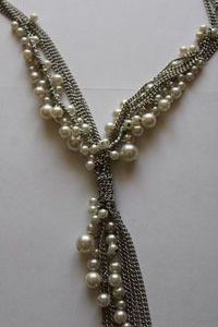 lot 173 image: Signed Forever 21 multiple strand metal and pearl tassel necklace on retail card. 12L. Overall length with tassel is 38L