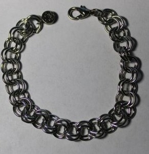 lot 180 image: Signed High IntenCity double link bracelet. Designed for charms. Has High IntenCity hang tag. Lobster clasp. 7.5L