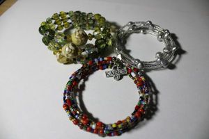 lot 195 image: Signed Kairos (Kairos Traders) wraparound multi color bead bracelet with Kairos 10 hang tag. Includes 2 additional wraparound bracelets