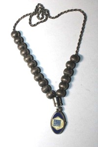 lot 202 image: Komboloi Greek vintage worry beads (prayeranxiety  stress beads) from Greece with enamel From Greece With Love hang tag. Heavy metal beads on metal rope chain.