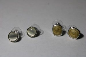 lot 206 image: (2) Signed Kenneth Cole poststud earrings. Both marked KC on reverse.