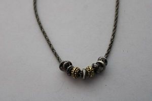 lot 221 image: Signed Liz Claiborne mixed metal bead rope necklace 14L with 4 extender. LC hangtag.
