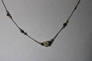 lot 222 image: Signed Liz Claiborne seed Pearl and Amethyst donut bead gemstone station necklace. Amethyst tested. Has LC hang tag. 14L. Spring ring clasp.
