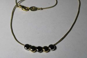 lot 223 image: Signed Liz Claiborne silver and gold slide bead necklace. Has LC hang tag. Lobster clasp. 14L