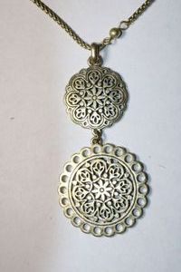 lot 229 image: Signed Lucky brand patinated gold ball bead and rope necklace with medallion pendant. Has 4-leaf clover hang tag. 28L