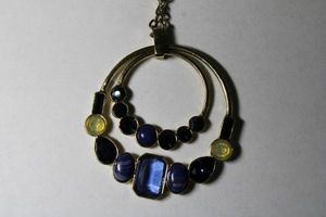 lot 240 image: Signed Banana Republic crystal accented circle pendants on necklace. On retail hang card with BR hang tag. 30L with 2 extender. Original price $39. Lobster clasp