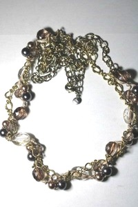 lot 242 image: Signed Anne Taylor Loft gold tone chain, glass bead, silk fabric and pearl necklace. Has Loft hang tag. 28L Lobster clasp.