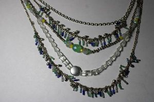 lot 247 image: Signed Anne Taylor Loft mixed multi chain, glass and rhinestone necklace. Has Loft hang tag. Lobster clasp. 16L with 2 Extender