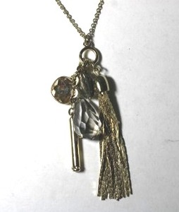 lot 249 image: Signed Anne Taylor Loft gold tone necklace with faceted glass pendant dangles and metal tassel. Has Loft hang tag. Spring ring clasp. 32L