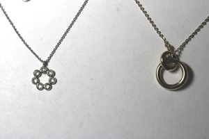 lot 252 image: (2) Signed Anne Taylor Loft necklaces. One Gold, One Silver tone. Spring ring clasps. Both have Loft hang tags Both 18L