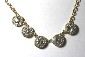 lot 255 image: Signed Magnolia gold plated necklace with faceted glass stations. Has M hang tag. Lobster clasp. 18L