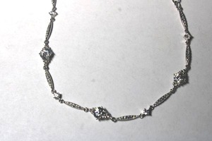 lot 261 image: Signed Nadri (Nordstrom) faceted CZ choker with CZ decorated lobster clasp and retail tag. 14L