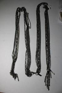 lot 265 image: Signed Daisy Fuentes lariat style multi chain necklace. Has Daisy Fuentes hang tag. Lobster clasp. 52L