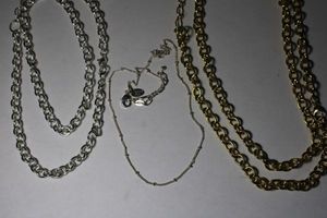 lot 274 image: (3) Signed Origami Owl necklaces. One gold tone oval 30L, Silver tone oval 30L and 18L. All have Origami Owl hang tags. The 2 oval link chains can be converted to double chain with lobster clasps.