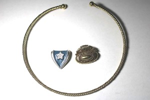 lot 279 image: Signed Pacific Design omega ring necklace with (2) slide pendants (one is enamel). End cap of omega unscrews to allow slides. Slides marked with Pacific Designs mark.