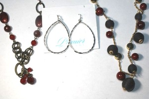 lot 281 image: (2) Signed Pacific Designs red and black necklaces. Both hang  tags. 38L and 24L. Also includes ear wire earring hoops on card and in branded storage bag.