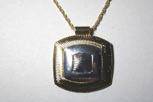 lot 283 image: Signed Roman (St. Louis, MO, 1973 - ) silver and gold pendant necklace. Marked RMN on extender hang tag. 18L with 3 extender. Pendant 1.75W