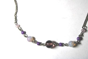lot 289 image: Signed Sequin (New York, 2000 - ) purple glass beaded station necklace. Has Sequin hang tag. 46L