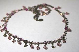 lot 291 image: Signed Sorelli (Lisa Oswald, New York, 1983 -) 100% hand soldered and crafted prong set crystal necklace. Has Sorelli hang tag. Lobster clasp. This company advertises free lifetime repairs.