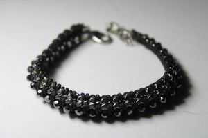 lot 299 image: Signed Stella  Dot faceted black rhinestone woven bracelet. Lobster clasp. Adjustable 7-8L
