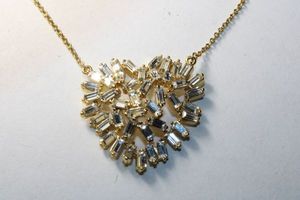lot 300 image: Signed Stella  Dot gold plated baguette blitz sparkling crystal heart pendant necklace. Marked Stella  Dot on extender hang tag. 16-18L