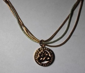 lot 301 image: Signed Ti Amo by Newbridge Silverware (Irish, 1934 - ) rose gold plated two-tone infinity link necklace. Inspired by lotus flowers. Has lotus flower hang tag. 18L.