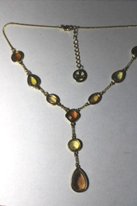 lot 306 image: Signed Crown Trifari (mark used 1955-1969) glass station necklace. Has Crown Trifari hang tag used when not enough room to add crown over the T.