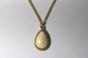 lot 307 image: Signed Trifari (post 1980) pear shape enamel pendant on 18L chain. Marked Trifari with TM symbol.