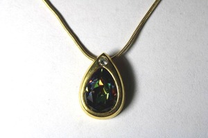 lot 312 image: Signed William Wang (Ocala, FL 1997 - ) Hand Set Swarovski iridescent Crystal faceted rainbow pear shape pendant necklace. Marked WW on reverse. 18L with 3 extender. Pendant 34.