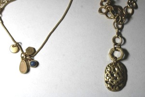 lot 317 image: (2) Signed Universal Thread Goods Co (Target) brand gold tone necklaces on retail cards. One with hammered pendant on textured link chain with toggle clasp. 22L and one with dangle pendants on layered chain with lobster clasp.
