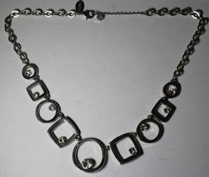 lot 322 image: Signed White House Black Market  (part of Chicos brand) reversible modernist station necklace. Crystal and black enamel on reverse. Has WHBM hang tag. 18L