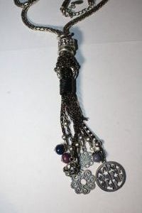 lot 325 image: Signed Waldeck Johnson (Native American, Southwest) tassel pendant necklace with Celtic Viking rune style medallion pendants and glass ball pendants on a flexible well crafted elongated link popcorn chain necklace. Has WJ hang tag. 28L. Lobster clasp.