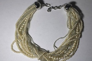 lot 97 image: Signed Monet torsade pearl multi strand necklace with polished silver end caps. Has Monet hang tag. Shepherd Crook clasp. 12L with 2 extender.