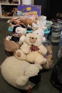 lot 110 image: Stuffed animal toys with tote and Its a Big Big World Atlas book
