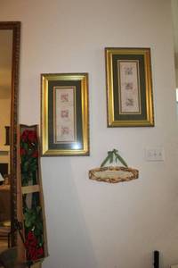 lot 122 image: Pair of green and gold wall art, ceramic home plaque, a dozen artificial long stem red roses.