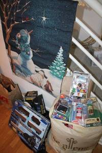 lot 141 image: Christmas lights, Polar Express train, Pop-up books, stocking stuffers, snowman banner and more
