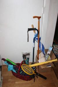 lot 127 image: Walking canes, bug zap racket, umbrellas, curtain rod holders