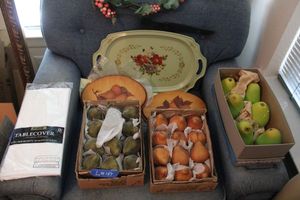 lot 157 image: Glitter pears, ceramic pears, wooden painted pears, white tablecloth, vintage tray and artificial vine