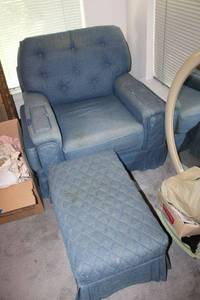 lot 158 image: Upholstered armchair with matching rolling ottoman