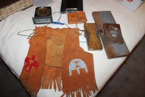 lot 175 image: Childs leather vest, vintage printing press wood blocks, binoculars, reel to reel tape, and timer