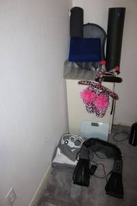 lot 180 image: Exercise items, heated blanket, lap desks, pink slippers, neck massager and scale