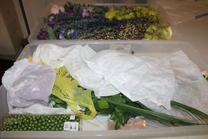 lot 181 image: 2 plastic under-bed storage boxes with artificial flowers and decorations