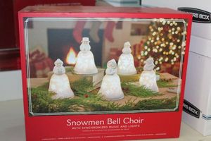 lot 193 image: Snowmen Bell Choir. Features color changing lights and music, unopened in box.