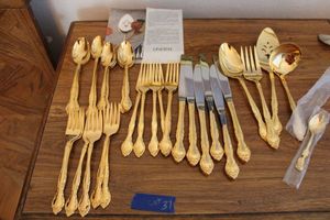 lot 37 image: Gold plated silverware as shown