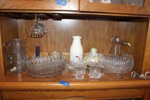 lot 43 image: Clear cut crystal serving dishes and candle holders plus candle wick cutter