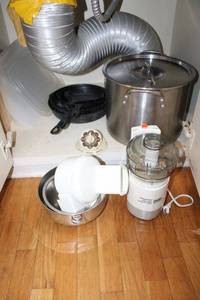 lot 64 image: Cast iron skillet set, stock pot, food processor, and cutting boards